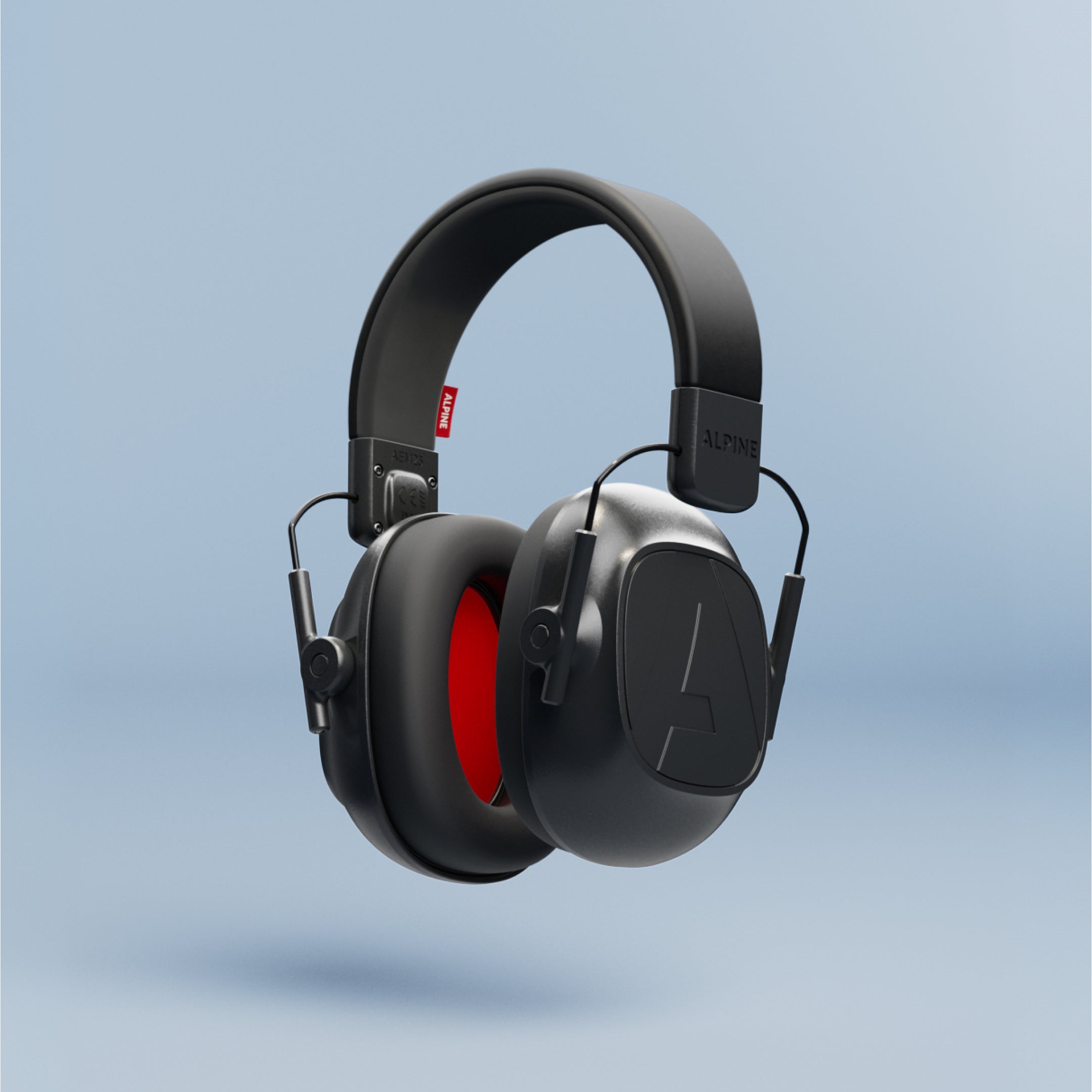 Alpine Defender earmuffs, side view on a light blue background