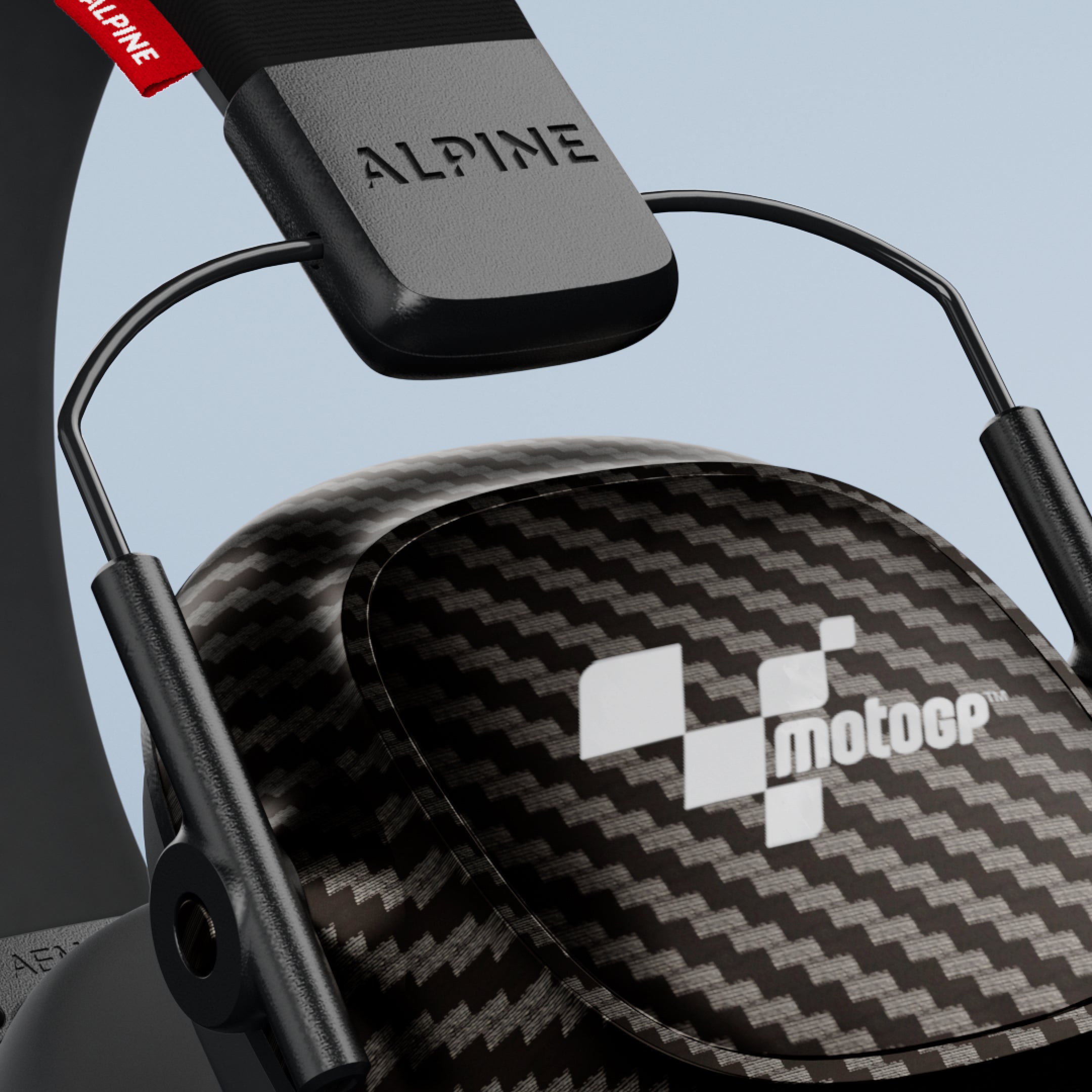 Close-up of an Alpine MotoGP Earmuffs ear cup with MotoGP logo and Alpine headband 