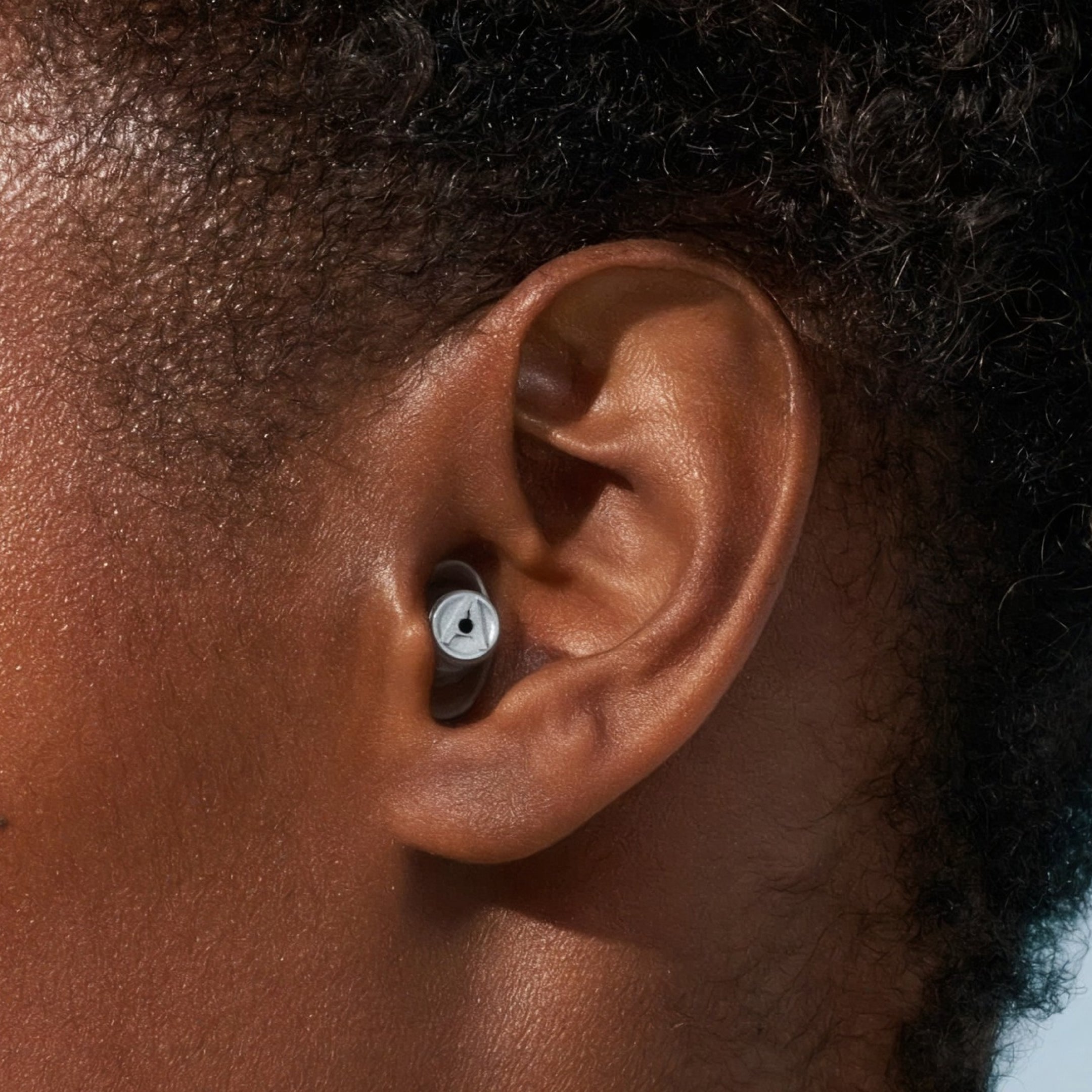 Close-up of an Alpine MusicSafe earplug worn in a person&