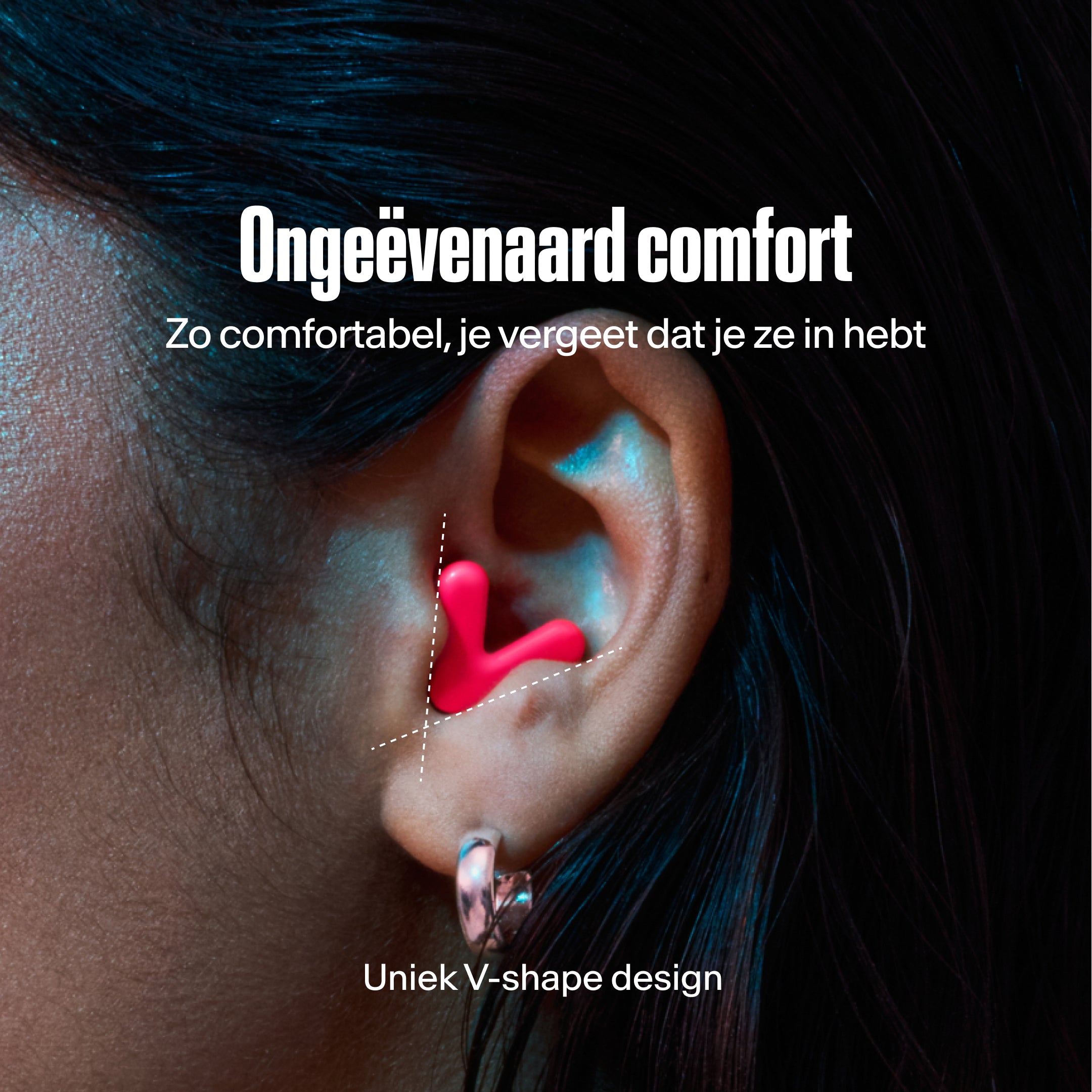 detailed image of an ear with an alpine tune earplug in neon-pink showing the snug fit in ear  