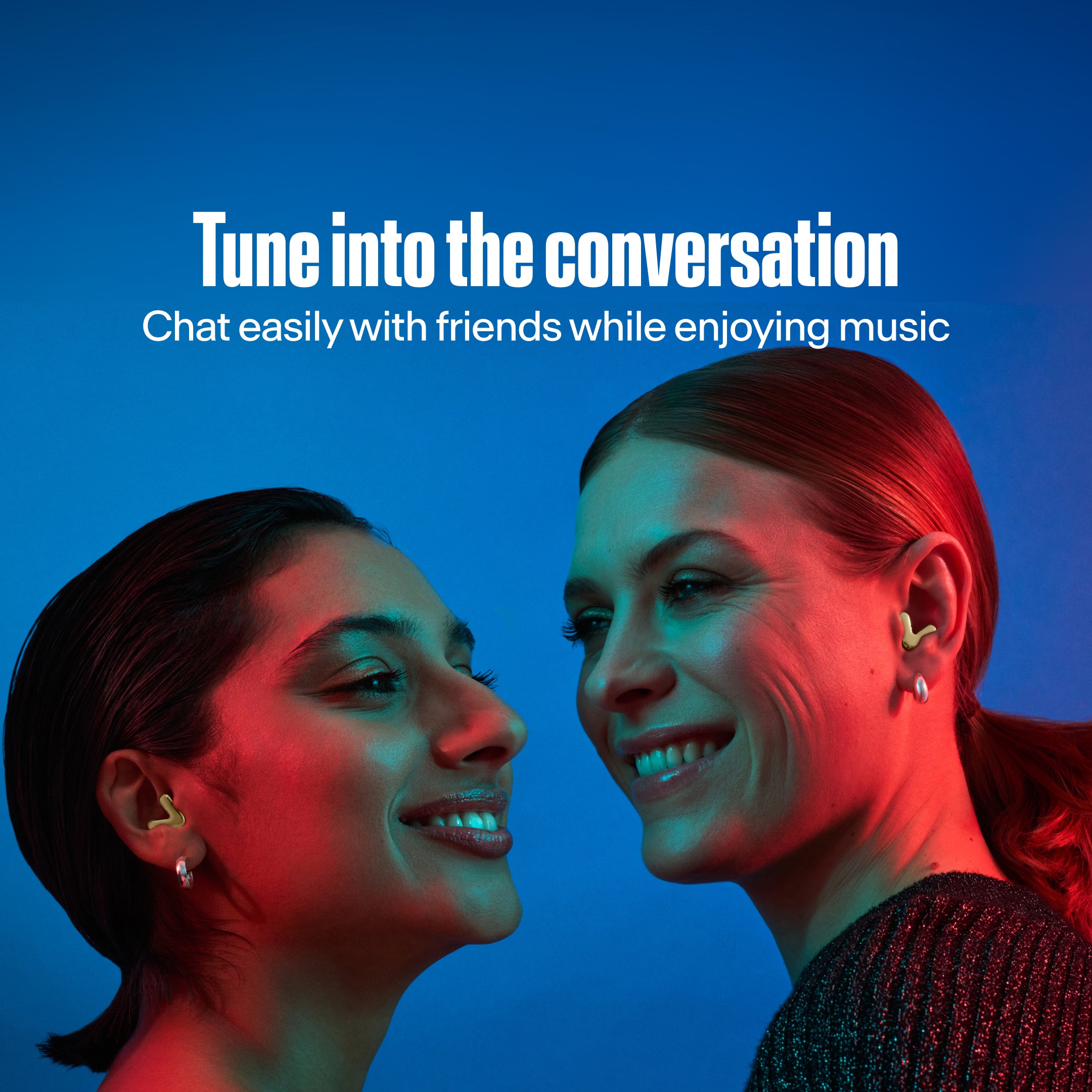 Two women with Alpine Tune in gold dance together 